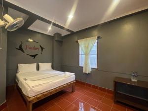 Voodi või voodid majutusasutuse Big Fish Resort Koh Tao toas
