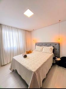 Ένα ή περισσότερα κρεβάτια σε δωμάτιο στο Apartamento para temporada