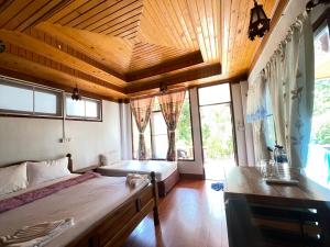 Voodi või voodid majutusasutuse Big Fish Resort Koh Tao toas