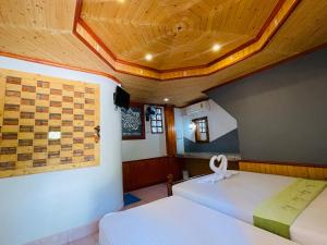 Voodi või voodid majutusasutuse Big Fish Resort Koh Tao toas