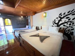 Voodi või voodid majutusasutuse Big Fish Resort Koh Tao toas