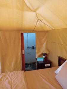 Postel nebo postele na pokoji v ubytování Surya Camp Buahan