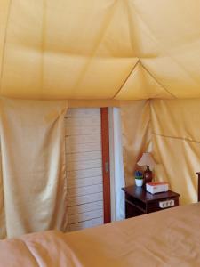 Postel nebo postele na pokoji v ubytování Surya Camp Buahan