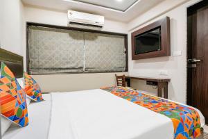 Postel nebo postele na pokoji v ubytování FabHotel Kamran Residency - Nr LBS Marg + 34 fotografií