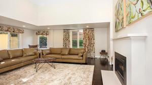 a living room with a couch and a fireplace at Glenluce Mountain Cottage Circa 1896 in Wentworth Falls