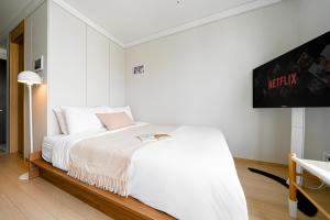 Cama o camas de una habitación en Urbanstay Myeongdong