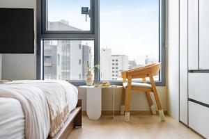 Cama o camas de una habitación en Urbanstay Myeongdong