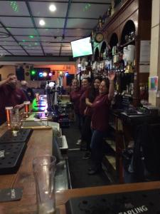 un grupo de personas de pie en un bar en Hardwick Hotel, en Horden