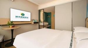 Postel nebo postele na pokoji v ubytování City Comfort Inn Nanning Guangxi University