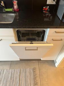 ครัวหรือมุมครัวของ Fribourg Home Junior