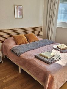 เตียงในห้องที่ Fribourg Home Junior