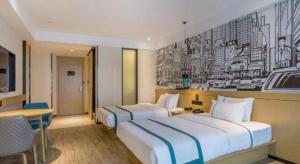 Łóżko lub łóżka w pokoju w obiekcie City Comfort Inn Wuhan Huangpu