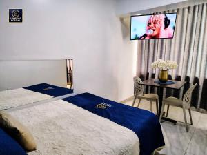 Postel nebo postele na pokoji v ubytování Comfort Hostal Lima
