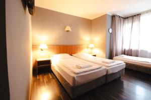 Cama ou camas em um quarto em Villa ENTO HotelWestEnd