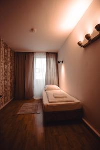 Cama ou camas em um quarto em Villa ENTO HotelWestEnd