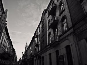 a black and white photo of a street with buildings at Kaktus Guest House in Katowice