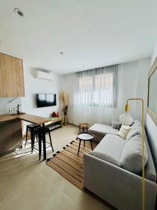 een woonkamer met een bank en een tafel bij TARIFA MOON The best place to be in Tarifa