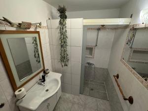 Kúpeľňa v ubytovaní Apartman Viki
