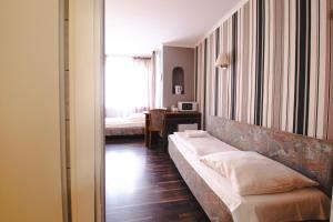 Cama ou camas em um quarto em Villa ENTO HotelWestEnd