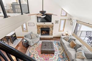 an overhead view of a living room with a fireplace at Vaulted Pines Lodge Hot Tub Game Room in Albrightsville +33 photos