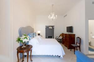Posteľ alebo postele v izbe v ubytovaní Palazzo Cacace Relais