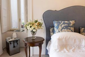 Posteľ alebo postele v izbe v ubytovaní Palazzo Cacace Relais
