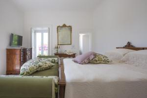 Posteľ alebo postele v izbe v ubytovaní Palazzo Cacace Relais
