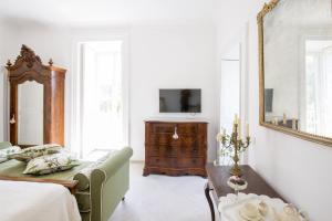 Posteľ alebo postele v izbe v ubytovaní Palazzo Cacace Relais