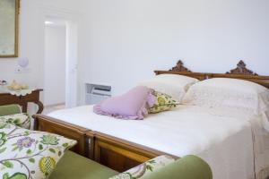 Posteľ alebo postele v izbe v ubytovaní Palazzo Cacace Relais