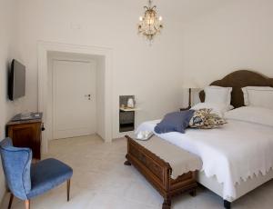 Posteľ alebo postele v izbe v ubytovaní Palazzo Cacace Relais