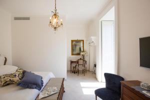 Posteľ alebo postele v izbe v ubytovaní Palazzo Cacace Relais
