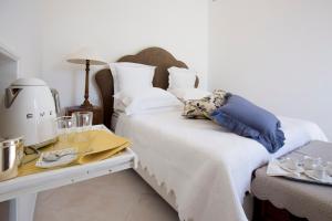 Posteľ alebo postele v izbe v ubytovaní Palazzo Cacace Relais