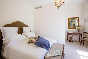 Posteľ alebo postele v izbe v ubytovaní Palazzo Cacace Relais