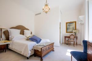 Posteľ alebo postele v izbe v ubytovaní Palazzo Cacace Relais