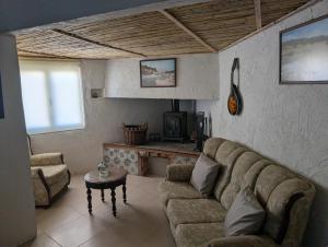 a living room with a couch and a table at Seesterne in Estrela