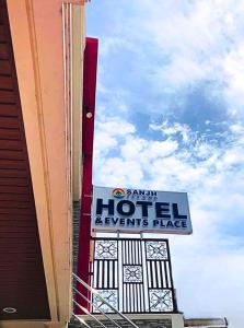 a sign for a hotel events place next to a building at SANJH Island Hotel powered by Cocotel in Roxas