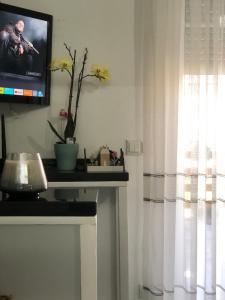 a living room with a tv and a fireplace at Beautiful 4-Bed House in the Weinviertel in Hollabrunn