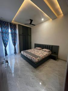 a bedroom with a bed and a ceiling at Aaroha Cove in Kālwāra +15 photos