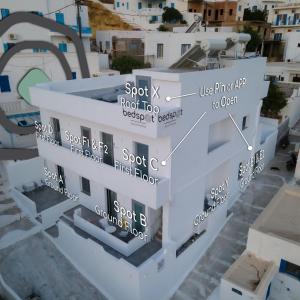 a rendering of a building with the names of buildings at Bedspot Apartments Astipalaia in Pera Gyalos