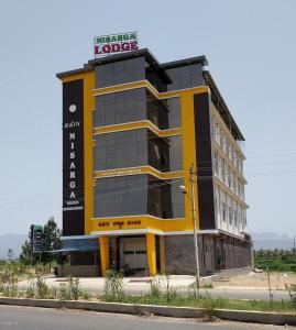 a large building with a sign on top of it at Townhouse Nisarga in Chikmagalūr +22 photos