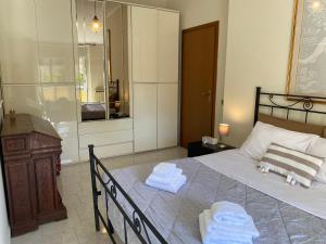 Кровать или кровати в номере Villino a Manziana-Roma