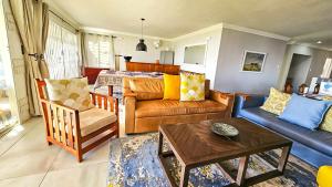 a living room with a couch and a table at Amore in West Point