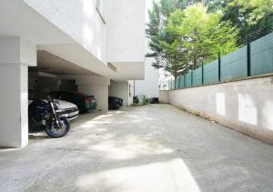 a parking lot with a motorcycle parked in a garage at Bright City Apartment Free Parking & 2 Min to Subway in Vienna