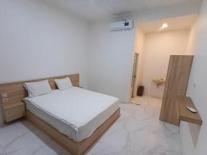 Ένα ή περισσότερα κρεβάτια σε δωμάτιο στο Pro Homestay +5 φωτογραφίες