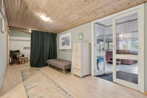 a bedroom with a bed and a desk and a window at Pool House With Space For Relaxation in Bording Stationsby +23 photos