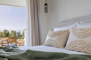 Postel nebo postele na pokoji v ubytování Kamara Apartments + 37 fotografií