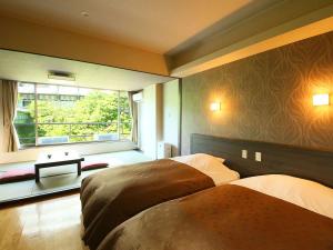 Voodi või voodid majutusasutuse Ooedo Onsen Monogatari Premium Hotel New Shiobara toas