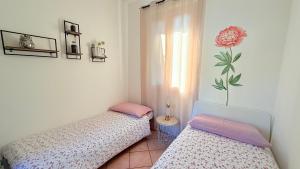 Katil atau katil-katil dalam bilik di L'Acero Rosso - Giardino privato e Box auto