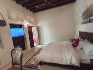 Ein Bett oder Betten in einem Zimmer der Unterkunft Hyba Heritage Guest House