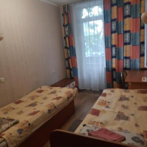 Postel nebo postele na pokoji v ubytování ГОТЕЛЬ Заводу 410 ЦА